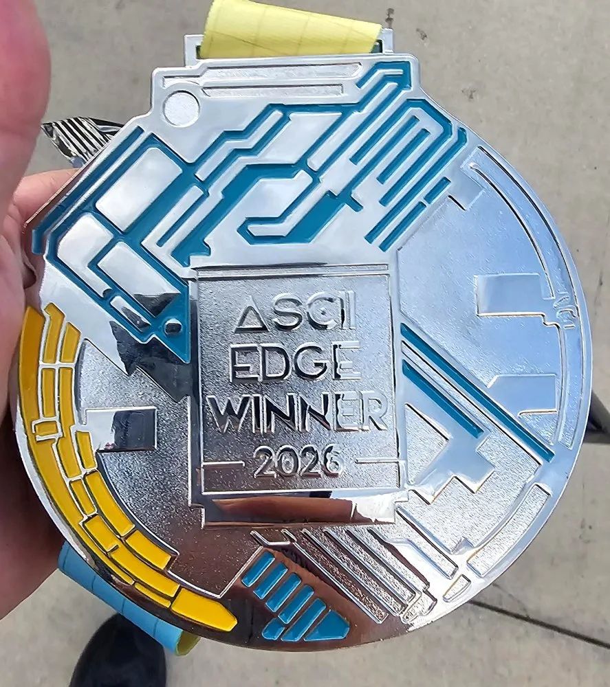 The ASCII Edge Winner 2026 medal awarded to RebelPSA for Best Exhibit Showcase